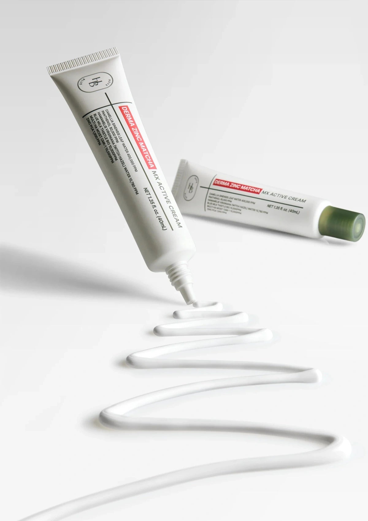 Two tubes of cream with a white background